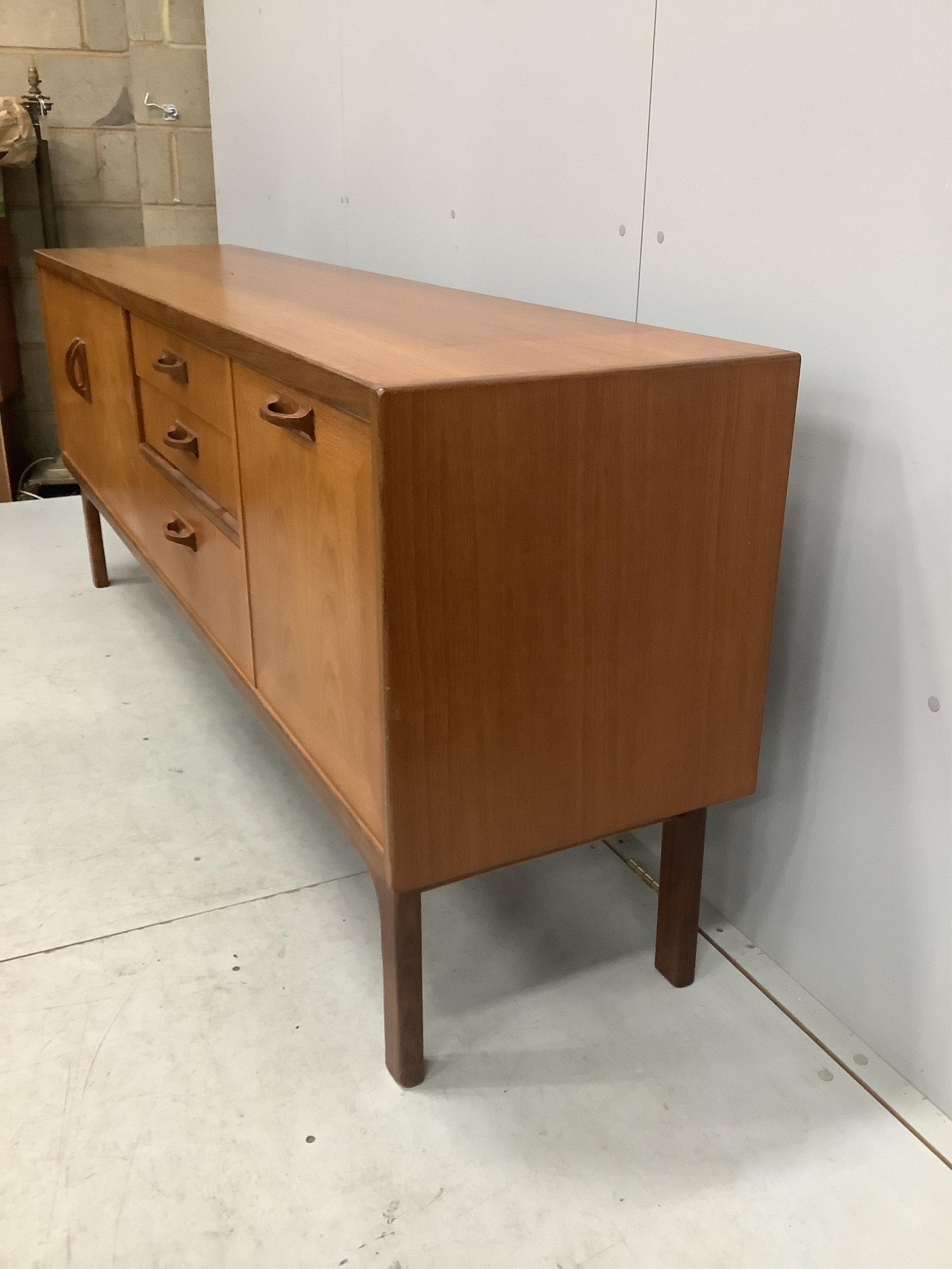 A mid century G Plan Sierra teak sideboard, width 205cm, depth 45cm, height 80cm. Condition - fair to good, some fading to top